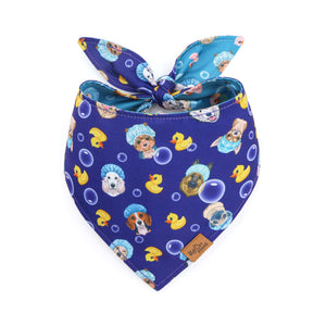 Blue bandana with cartoon dog and duck pattern on a white background