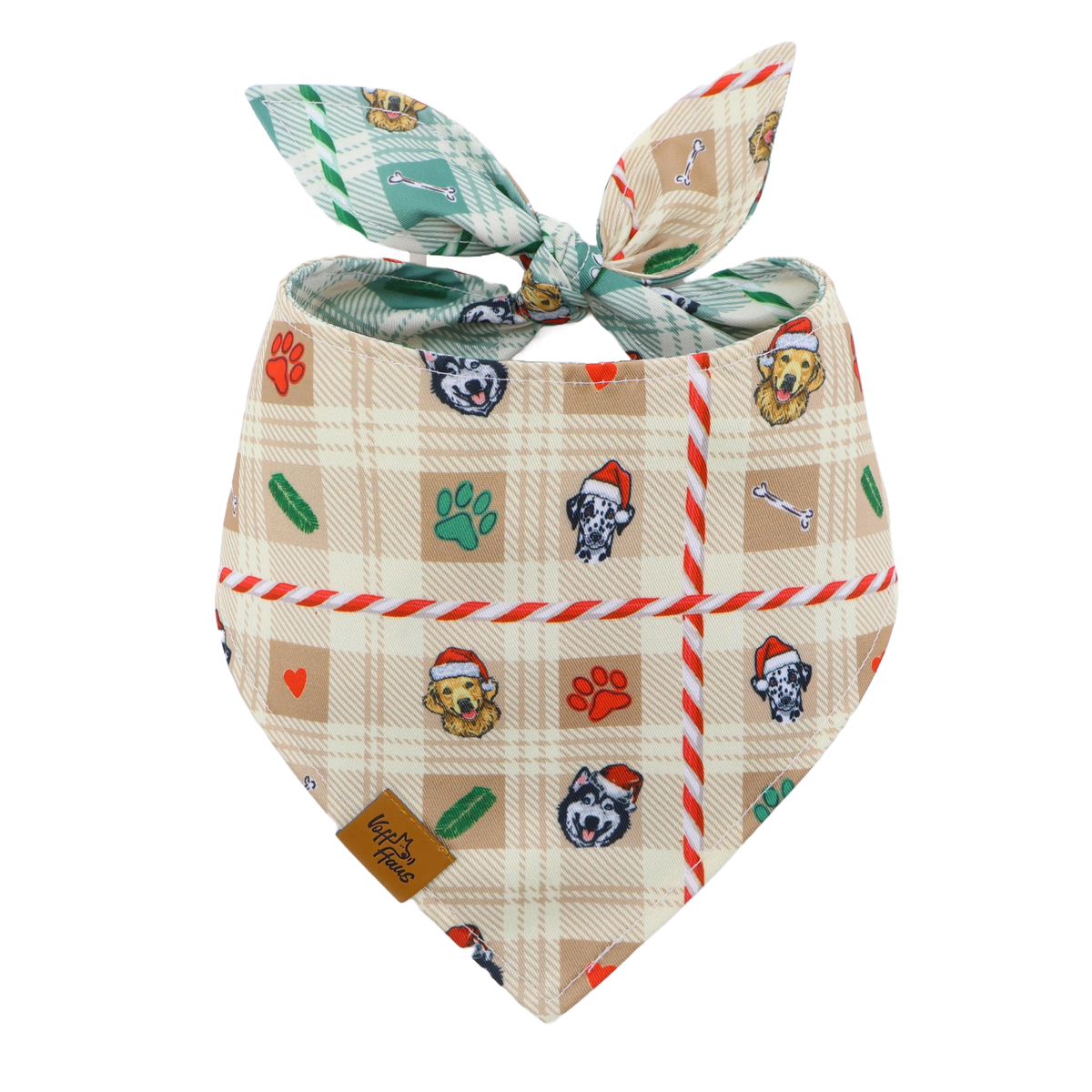 The Candy Cane Tails reversible dog bandana tied flat, cream side with Santa pups and candy cane stripes