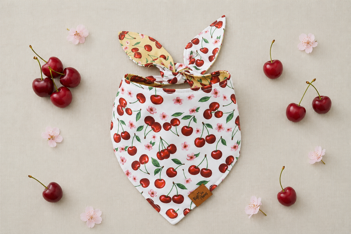 Cherry Pop reversible dog bandana, ivory side with red cherries and pink blossom