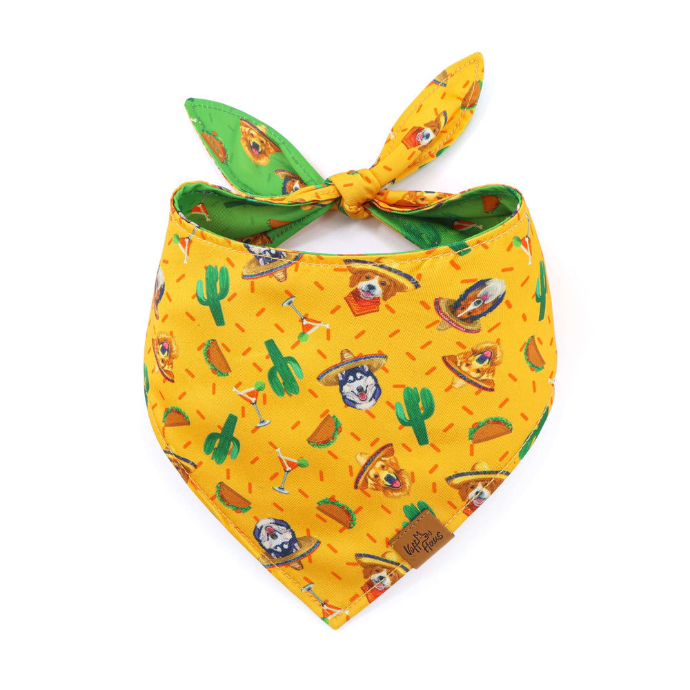Yellow bandana with cartoon dog and cactus pattern on a white background