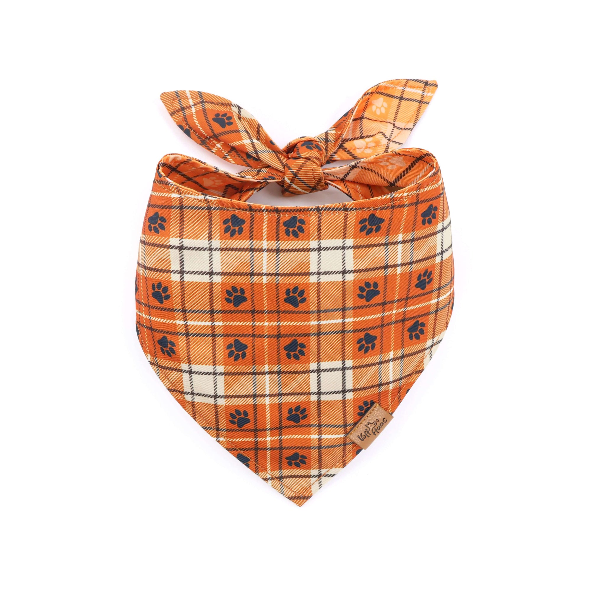 Plaid dog bandana with paw prints on a white background