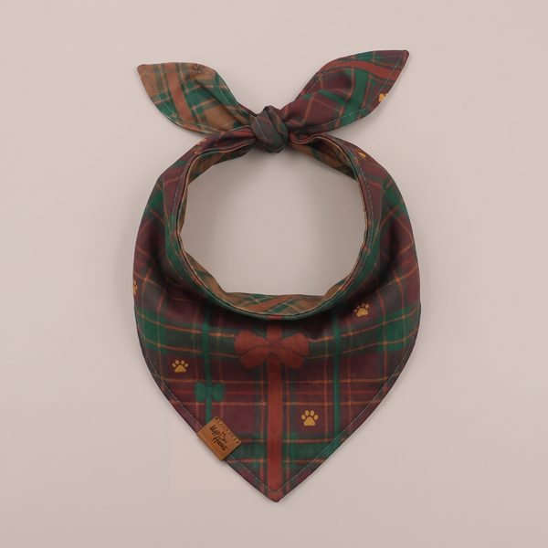 Bark The Halls reversible dog bandana, Cranberry Plaid side, tied flat lay